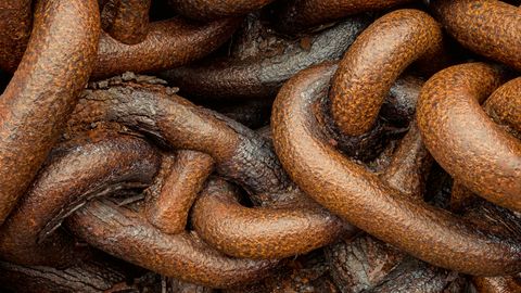 Close-up of heavy, rusty interlocking chain links