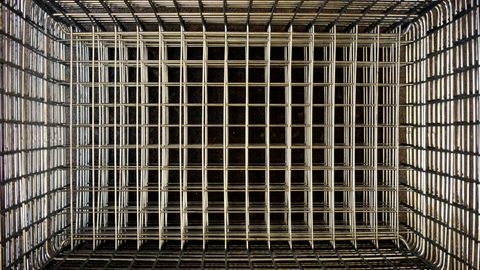 An empty wire shopping basket seen from above